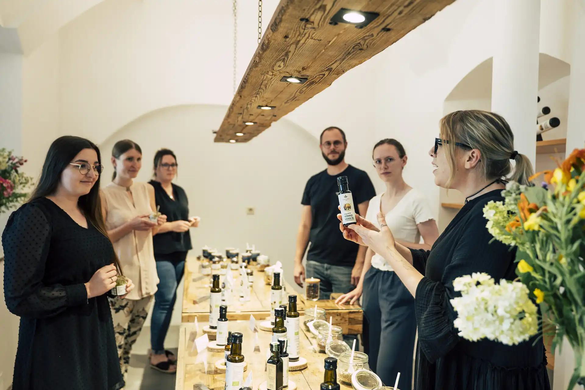 Company tour with pumpkin seed oil tasting at a long wooden table